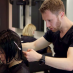 David Rozman cutting and styling a ladies hair in manchester hairdressers