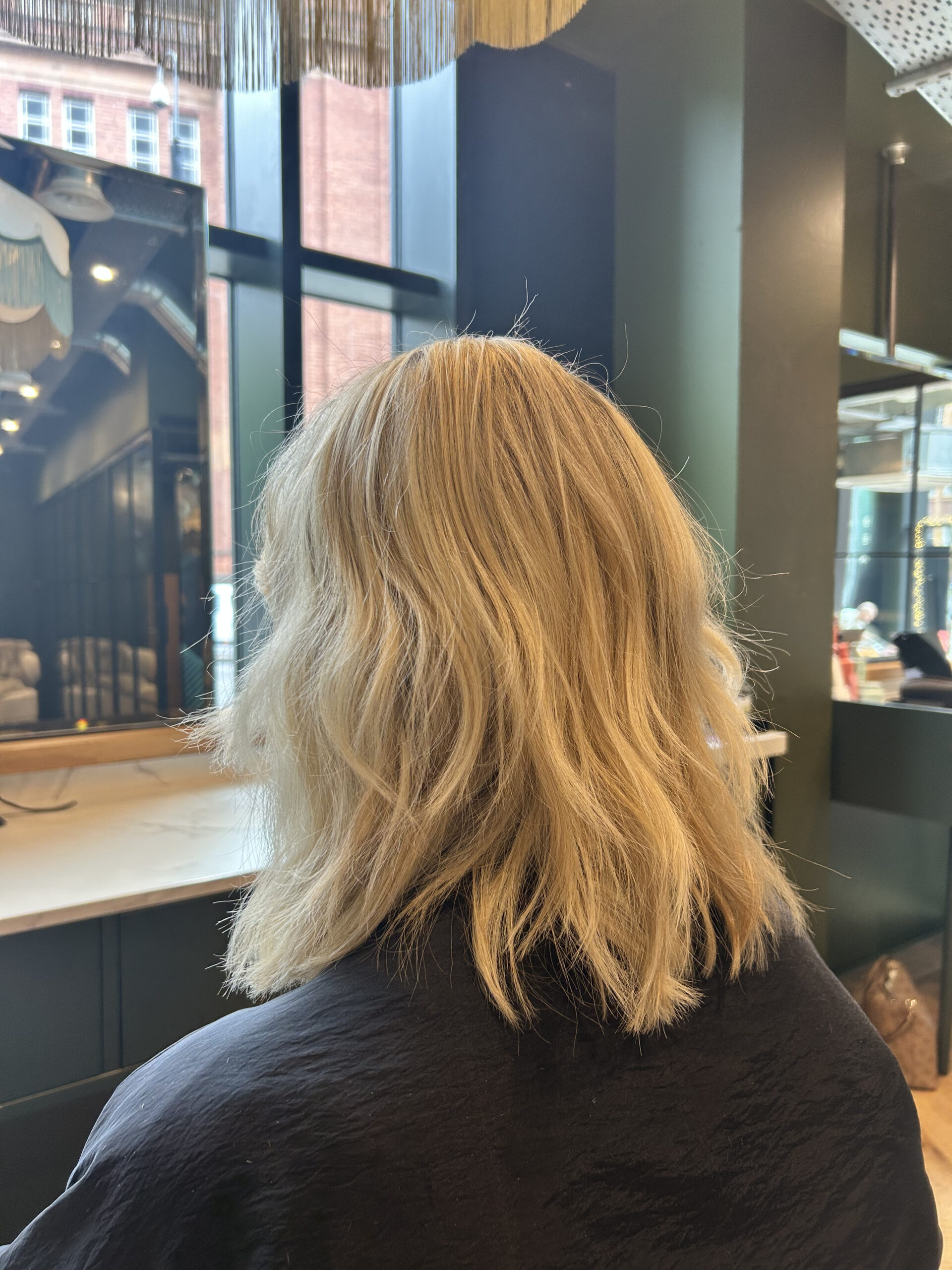 Blonde full head highlights on ladies hair in manchester hairdressers