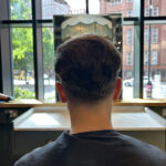 hair system installation on man in manchester best hair salon