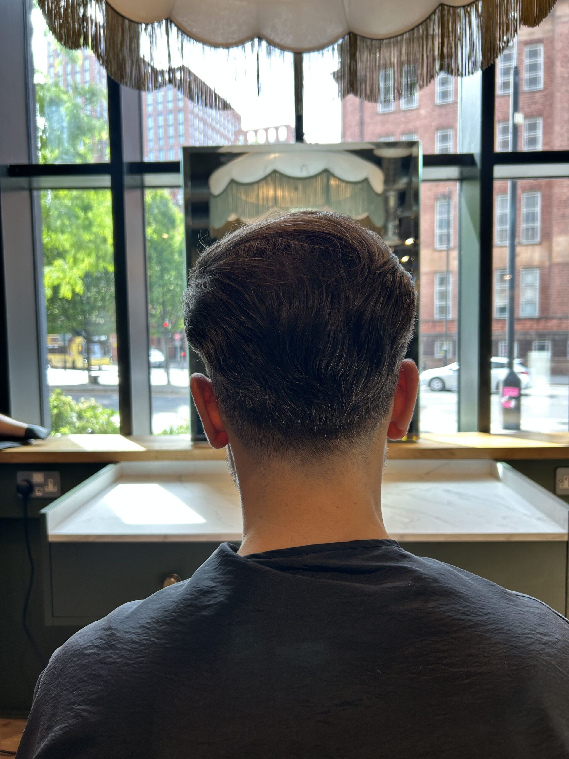hair system installation on man in manchester best hair salon