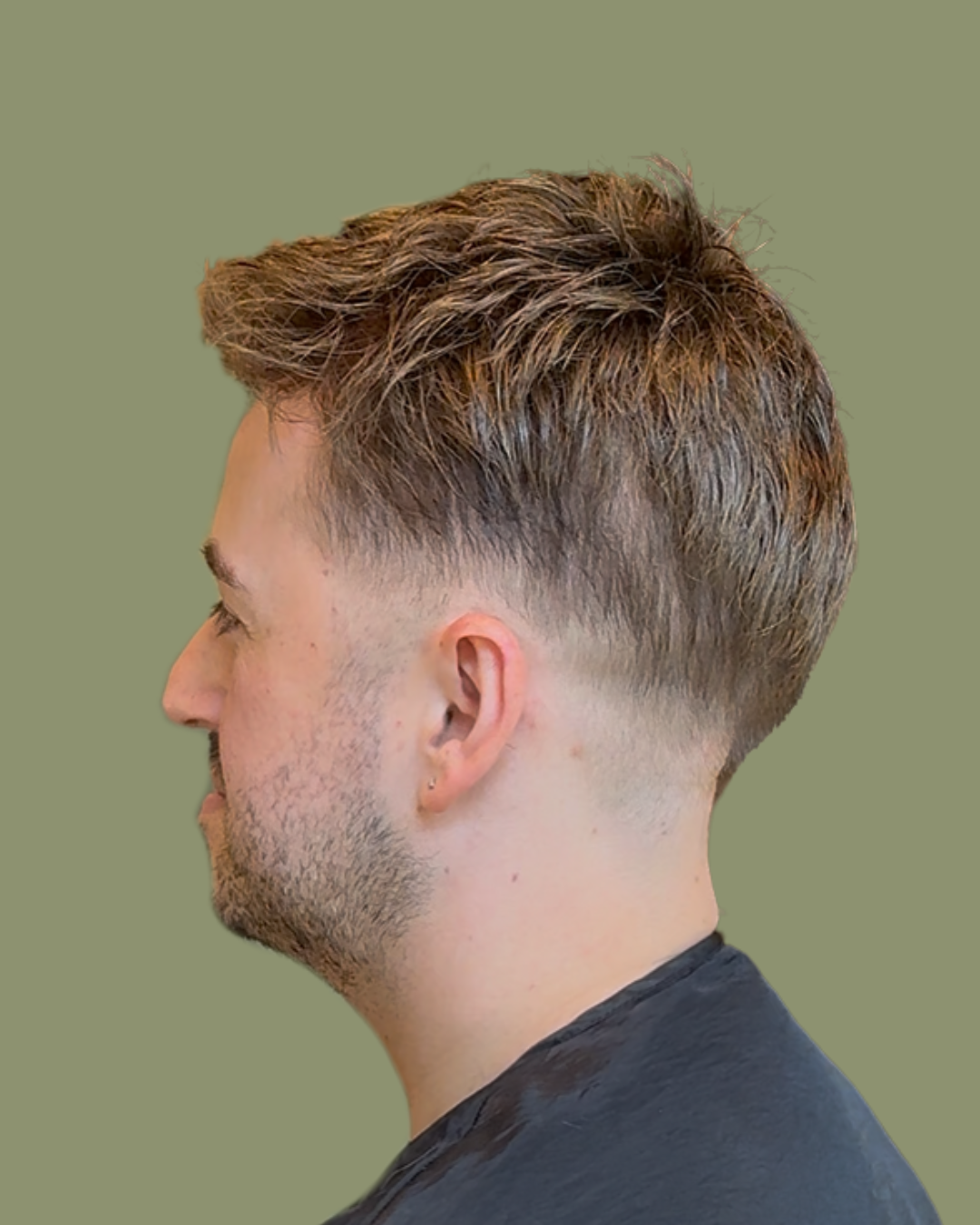 Close-up of a fitted hair system being cut and blended into natural hair